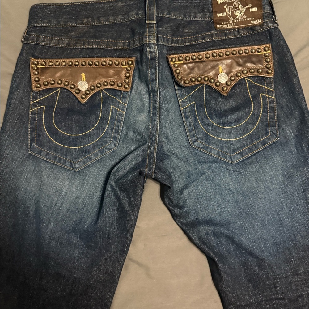 True Religion Made in USA Jeans with brown leather pocket accents. Hard to find
